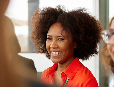 close-up of business person in an orange shirt